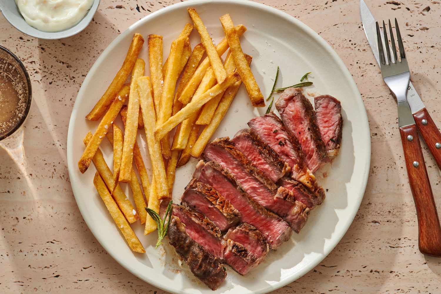 Steak Frites served with sauce