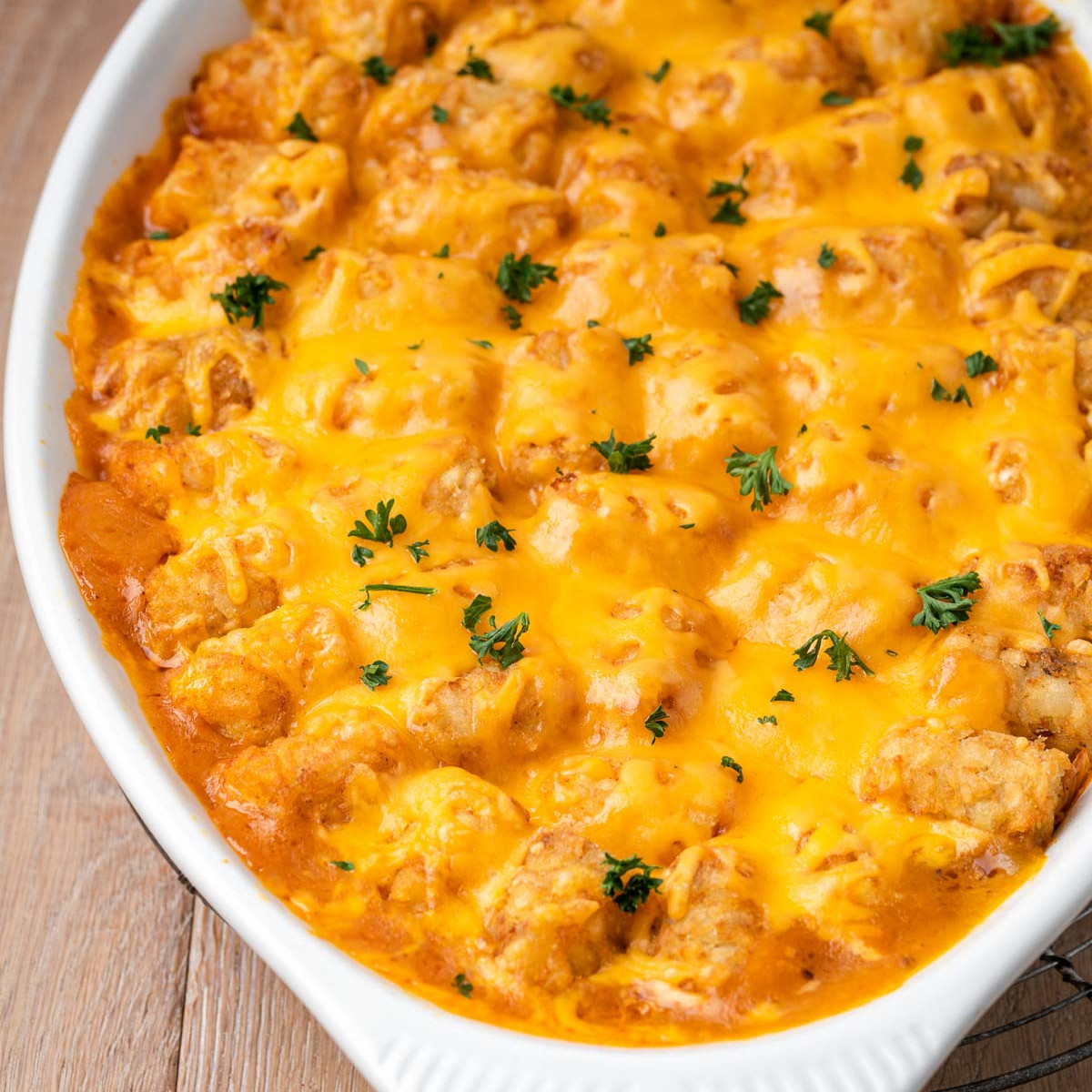 Cheeseburger Tater Tot Casserole served with fresh toppings