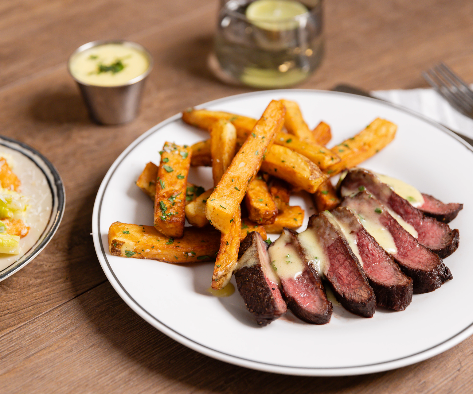 Perfectly cooked Steak Frites with sauce