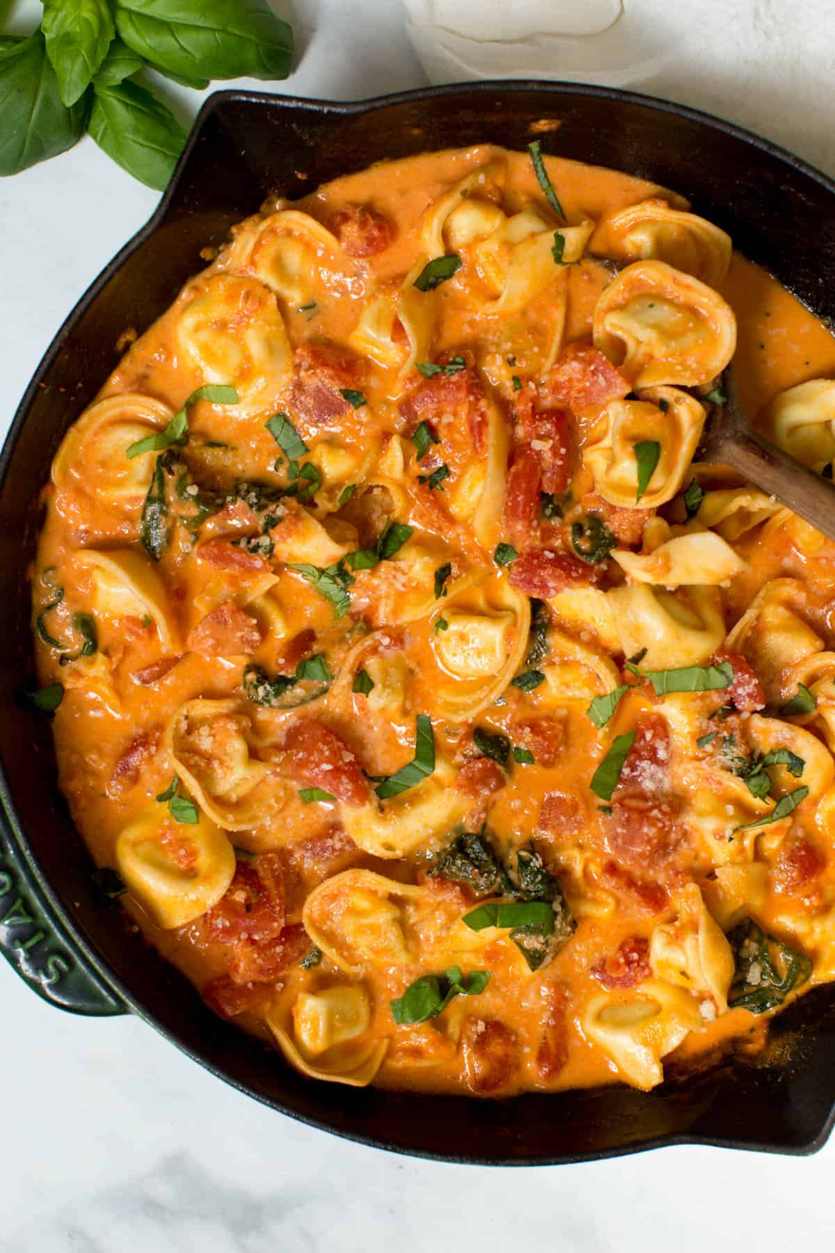 Creamy Tortellini with Tomatoes in a skillet