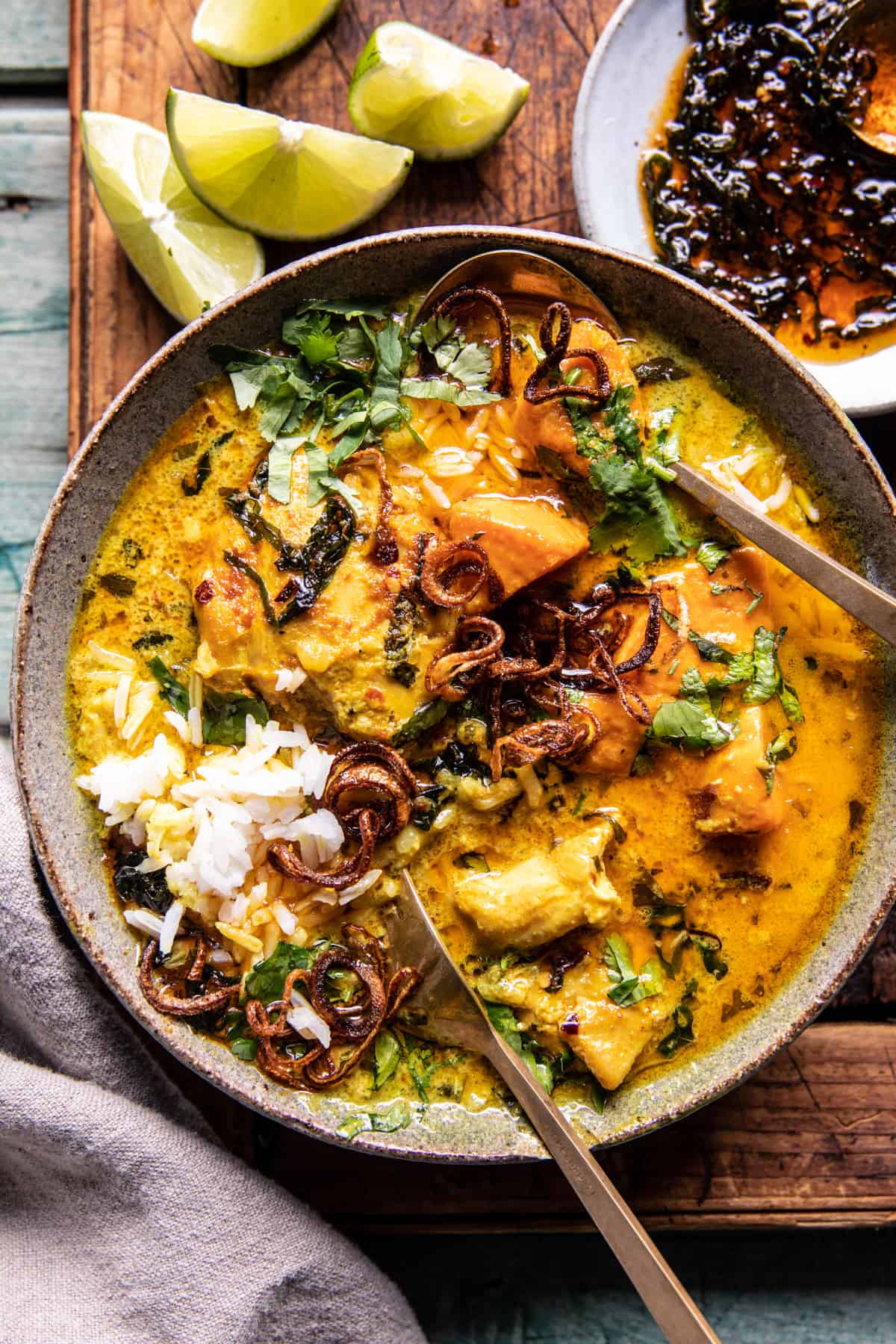 Beautifully plated Crockpot Coconut Curry Chicken with rice and garnishes