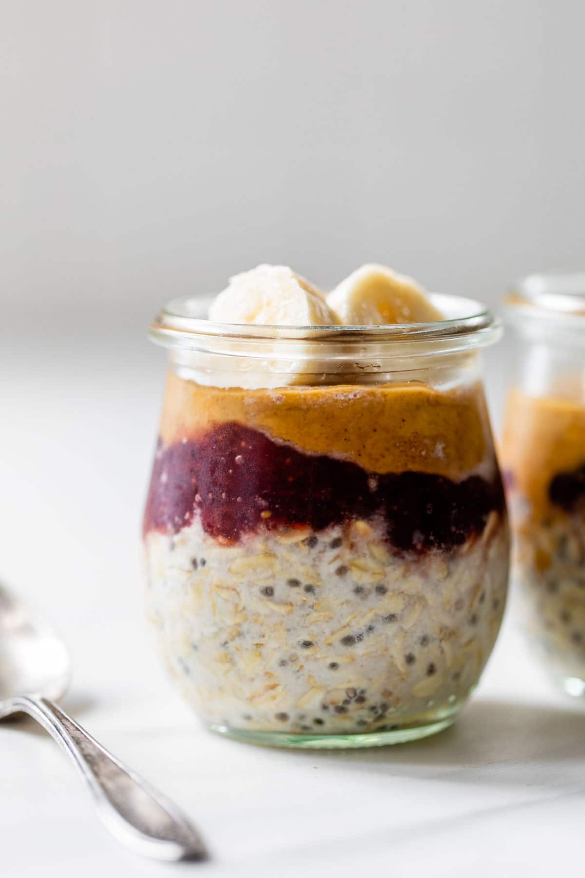 Layered Peanut Butter and Jam Overnight Oats showing beautiful layers