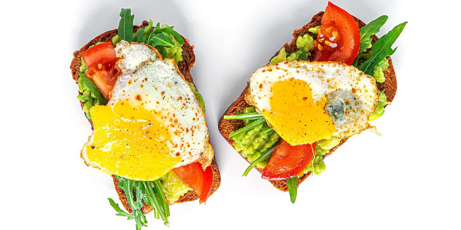 Avocado Toast with Eggs Spinach and Tomatoes